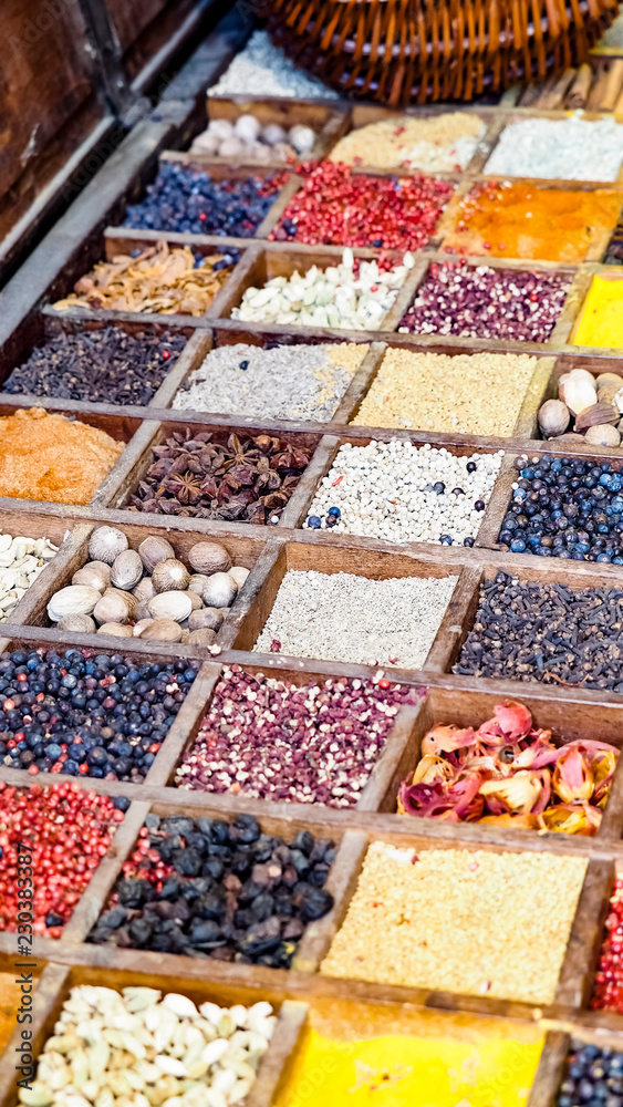 Collection colorful mosaic spices in wooden box. Assortment of condiment cooking ingredient. Seasoning background banner