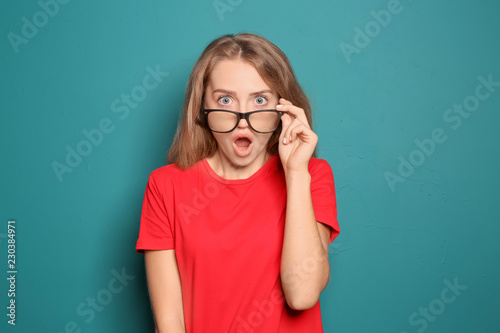 Portrait of shocked young w...