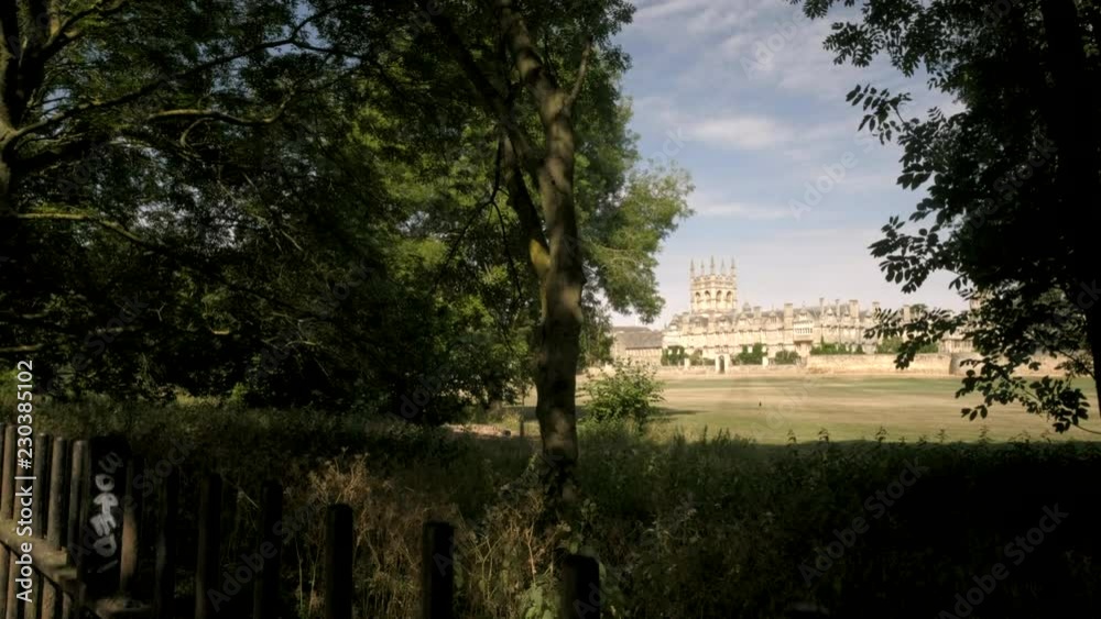 Camera rises from behind fence to reveal Merton College Oxford Camera rises from behind fence to reveal Merton College Oxford