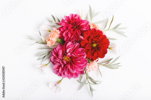 Fototapeta Naklejka Na Ścianę i Meble -  Festive flowers red dahlias composition on the white background. Overhead top view, flat lay. Copy space. Birthday, Mother's, Valentines, Women's, Wedding Day concept