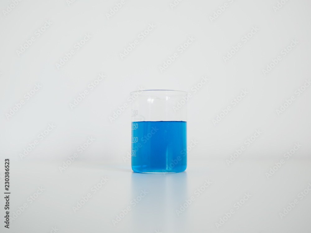 Laboratory beaker on white table Laboratory beaker on white table