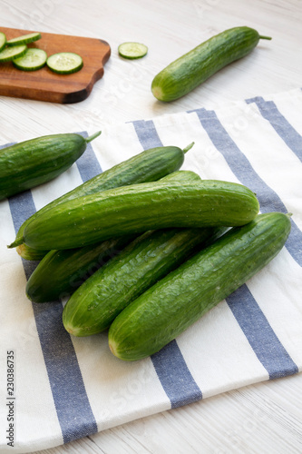 Fresh raw organic green cucumbers, side view. Close-up.