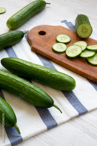 Fresh raw organic green cucumbers, side view. Closeup.