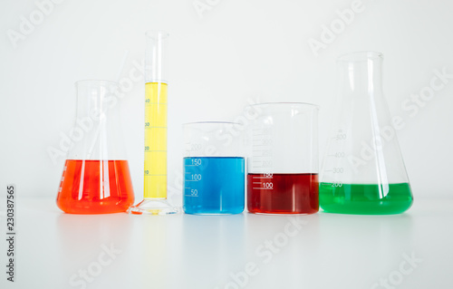 Laboratory glassware on white lab table