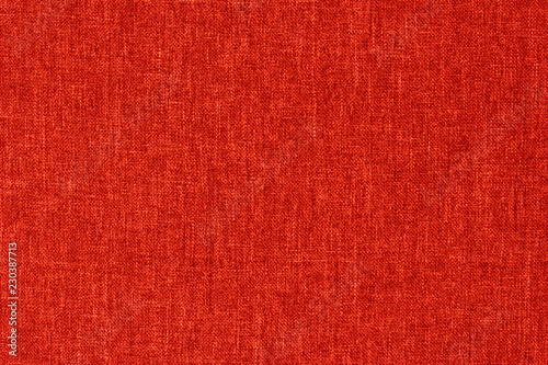 Red textile  texture for background with visible fibers. 