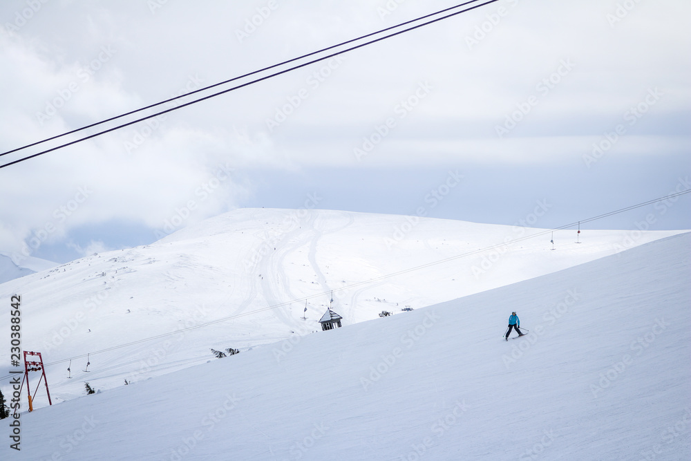 Skier in the Carpathian Mountains in the winter. Dragobrat View from the top. Snow drops Winter fairy tale. Traveling