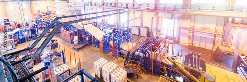 Fiberglass production industry equipment at manufacture background