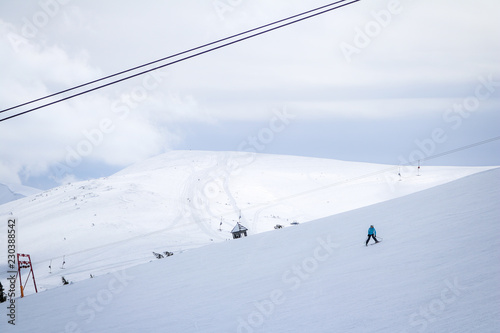 Skier in the Carpathian Mountains in the winter. Dragobrat View from the top. Snow drops Winter fairy tale. Traveling