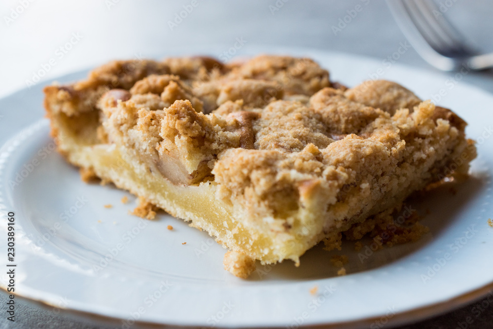 Homemade Apple Crumble Cake Slice with Fork. Homemade Apple Crumble Cake Slice with Fork.