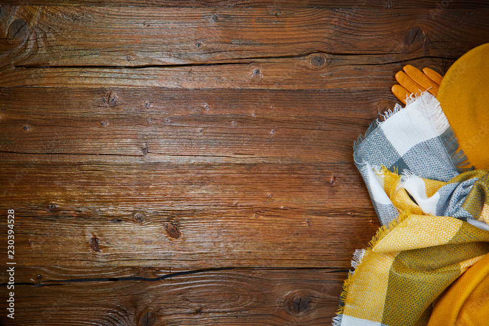 Autumn clothes top down view on wooden table Autumn clothes top down view on wooden table