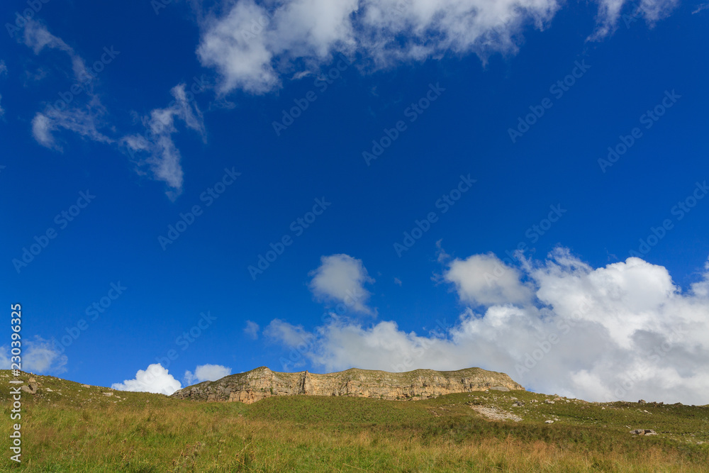 View of the mountain plateau in the clouds in the summer in the North Caucasus in Russia. View of the mountain plateau in the clouds in the summer in the North Caucasus in Russia.
