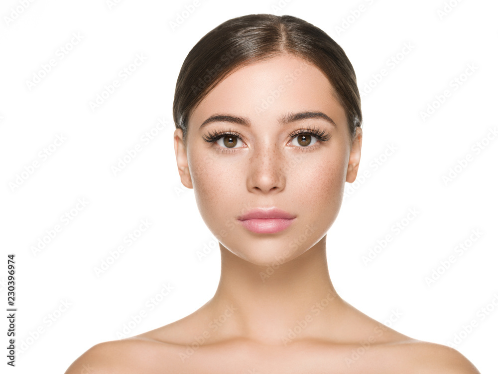 Beautiful woman face close up healthy skin and beauty lashes soft lips isolated on white Beautiful woman face close up healthy skin and beauty lashes soft lips isolated on white
