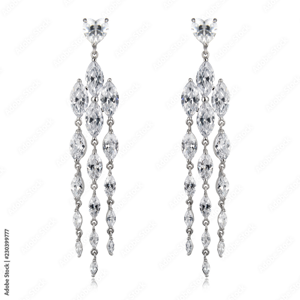 Pair of silver diamond earrings isolated on white Pair of silver diamond earrings isolated on white