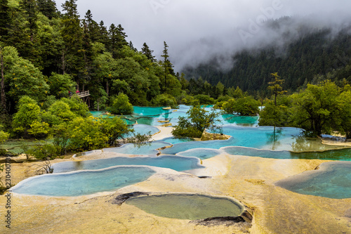 Huanglong National Park, Sichuan, China, famous for its colorful pools formed by calcite deposits. Situated at more than 3000m elevation, it is a UNESCO World heritage site