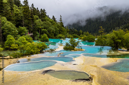 Huanglong National Park, Sichuan, China, famous for its colorful pools formed by calcite deposits. Situated at more than 3000m elevation, it is a UNESCO World heritage site photo