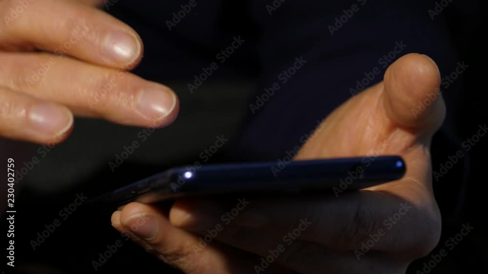 Close-up woman's hands uses smartphone browsing internet for online business marking. woman uses a mobile phone. 4K Close-up woman's hands uses smartphone browsing internet for online business marking. woman uses a mobile phone. 4K
