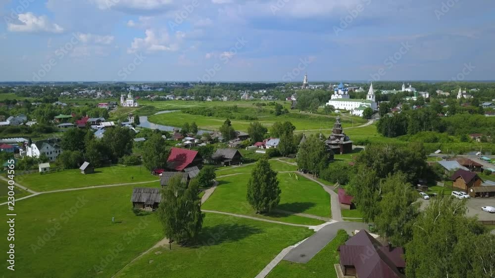 Flying over ancient city Suzdal, Golden ring of Russia on Sunny summer day Flying over ancient city Suzdal, Golden ring of Russia on Sunny summer day