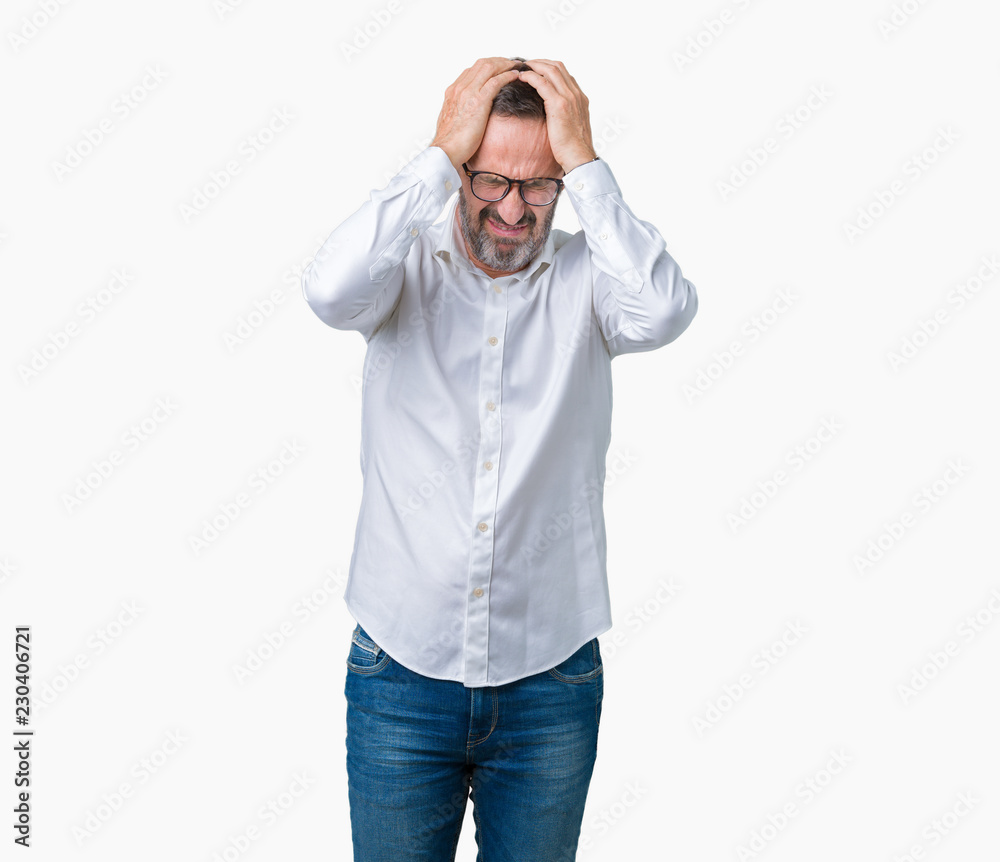 Handsome middle age elegant senior business man wearing glasses over isolated background suffering from headache desperate and stressed because pain and migraine. Hands on head. Handsome middle age elegant senior business man wearing glasses over isolated background suffering from headache desperate and stressed because pain and migraine. Hands on head.