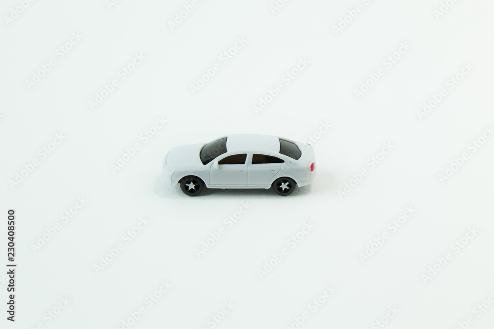 white car toy on white background image close up. white car toy on white background image close up.