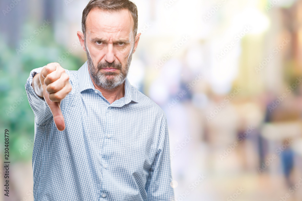 Middle age hoary senior business man over isolated background looking unhappy and angry showing rejection and negative with thumbs down gesture. Bad expression. Middle age hoary senior business man over isolated background looking unhappy and angry showing rejection and negative with thumbs down gesture. Bad expression.