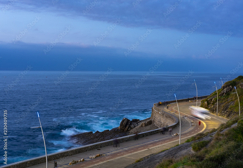 Car lights going by the sea in the city of San Sebastian, Basque Country