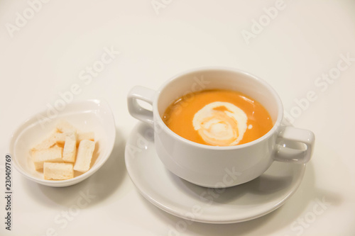  Pumpkin  soup with cream in  white cup ..
