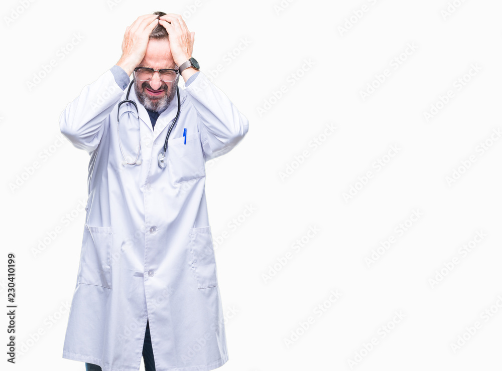 Middle age senior hoary doctor man wearing medical uniform isolated background suffering from headache desperate and stressed because pain and migraine. Hands on head. Middle age senior hoary doctor man wearing medical uniform isolated background suffering from headache desperate and stressed because pain and migraine. Hands on head.