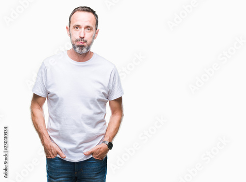 Middle age hoary senior man wearing white t-shirt over isolated background puffing cheeks with funny face. Mouth inflated with air, crazy expression.