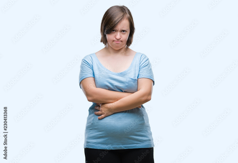 Young adult woman with down syndrome over isolated background skeptic and nervous, disapproving expression on face with crossed arms. Negative person. Young adult woman with down syndrome over isolated background skeptic and nervous, disapproving expression on face with crossed arms. Negative person.