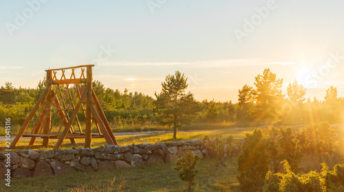 estonian swing set in sunset photo