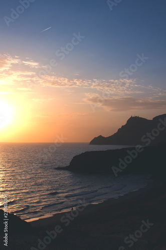 Mediterranean coastline  lonely beach and mountains in Cabo de Gata at sunset. Cala Barronal  Almeria  Andalucia  Spain