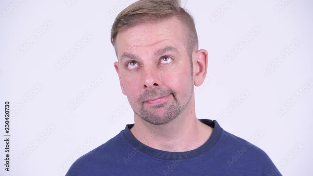 Portrait of tired blonde man looking bored Portrait of tired blonde man looking bored