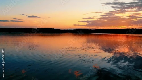 Ruza, Russia - August, 2018: Wonderful sunset on the lake with beautiful clouds. photo