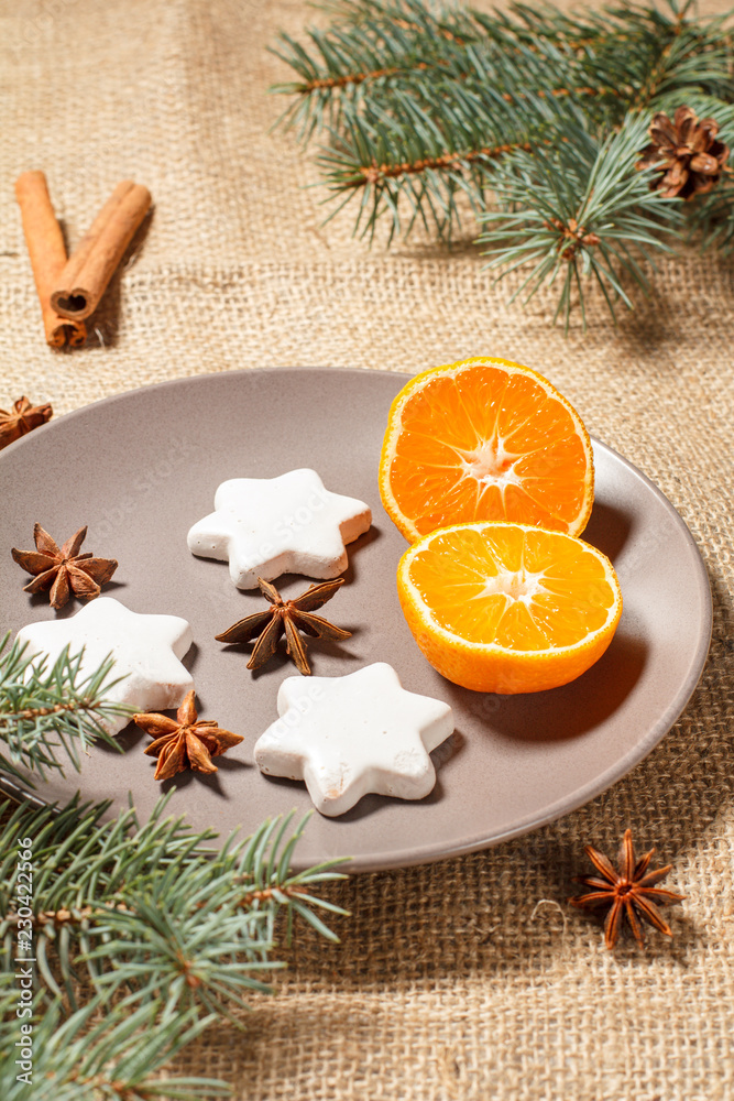 Gingerbread cookies in star shape and orange on plate Gingerbread cookies in star shape and orange on plate