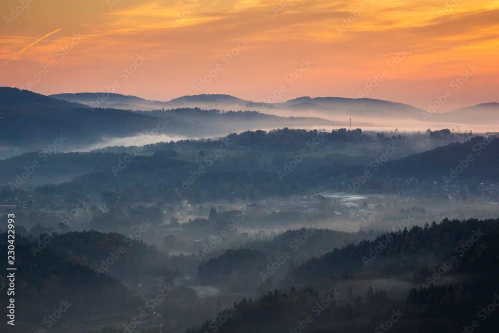 Sunrise in Rudawy Janowickie at foggy morning, Silesia, Poland