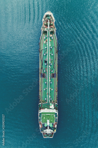 Oil Ship tanker park on the sea waiting transfer to oil refinery for transportation or energy concept background.