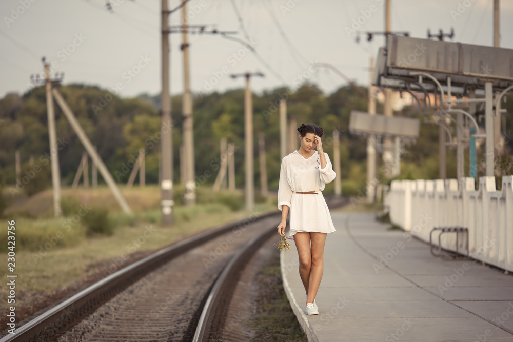 Young woman waiting for someone on train station