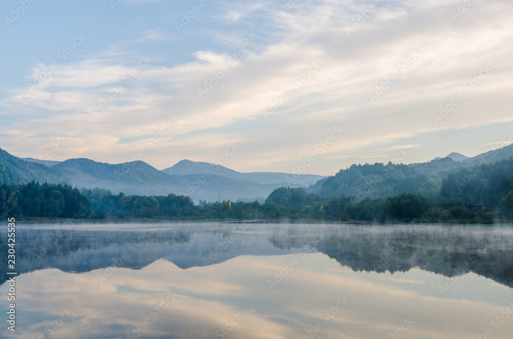 Morning lights above the lake in the Transylvanian mountains