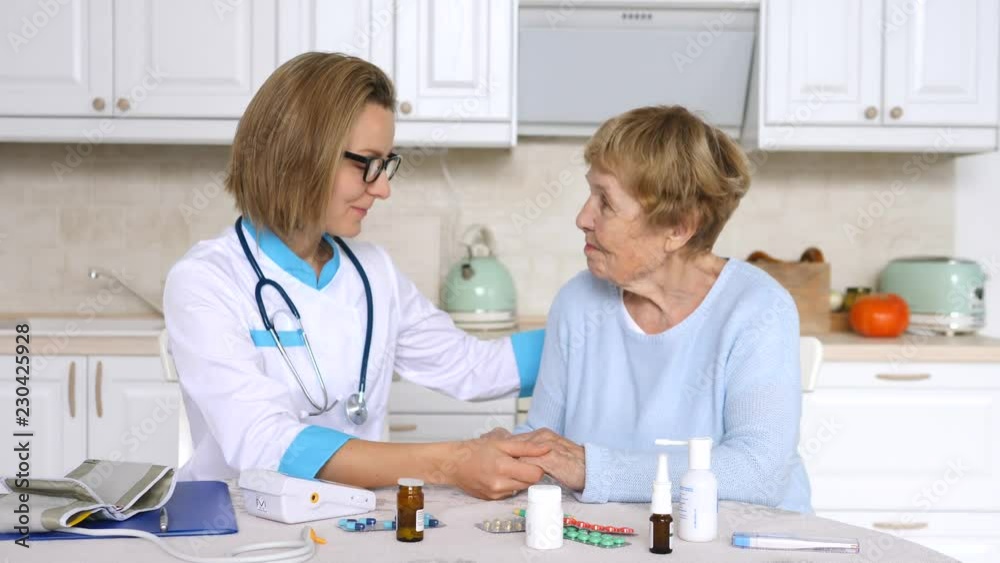 Senior Woman With Her Home Caregiver Senior Woman With Her Home Caregiver