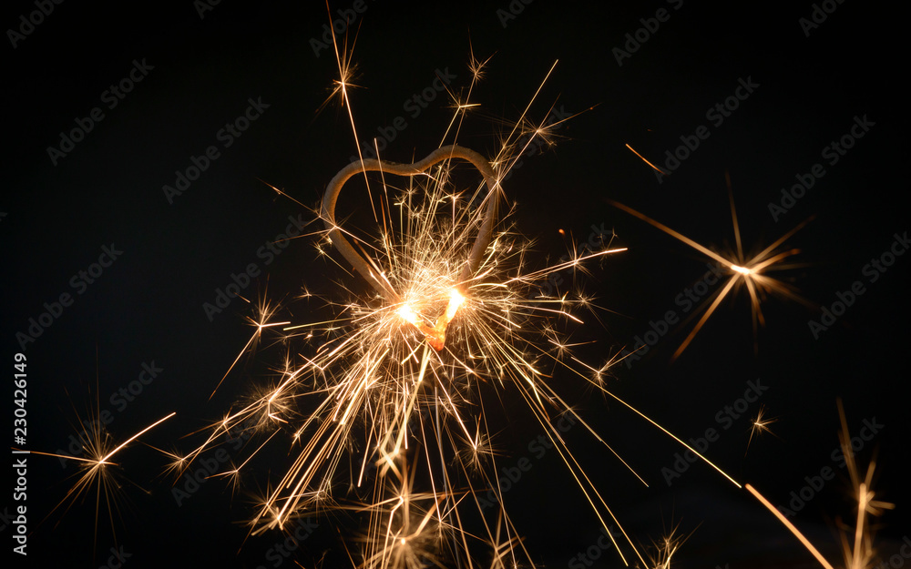 heart sparklers for celebration christmas and happy new year party background,