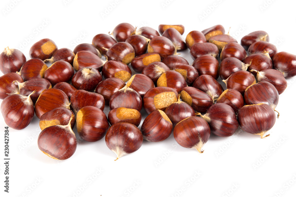 Fresh chestnuts with peeled roasted chestnut isolated on white background. Hippocastanum isolated. Fresh chestnuts with peeled roasted chestnut isolated on white background. Hippocastanum isolated.
