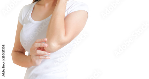 Woman applying elbow cream,lotion , Hygiene skin body care concept. photo