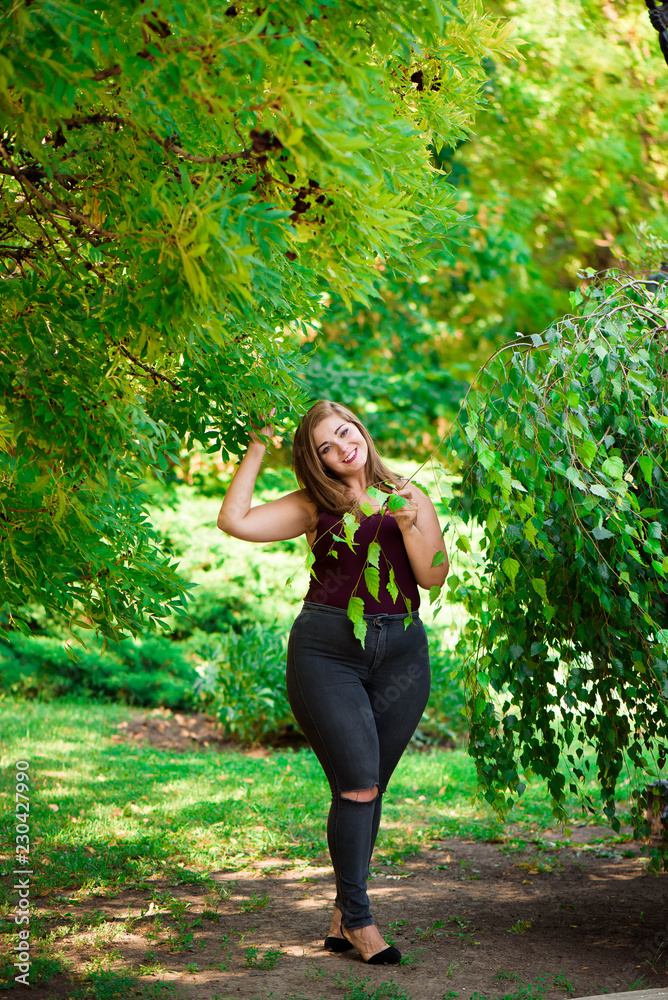 Single Young Pretty Plus Size Caucasian Happy Smiling Laughing Girl Woman, Walking In Summer Green Forest. Fun Enjoy Outdoor Summer Nature. Single Young Pretty Plus Size Caucasian Happy Smiling Laughing Girl Woman, Walking In Summer Green Forest. Fun Enjoy Outdoor Summer Nature.
