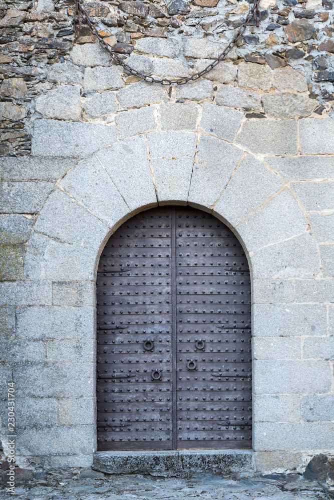 Ancient iron gates of a medieval castle Ancient iron gates of a medieval castle