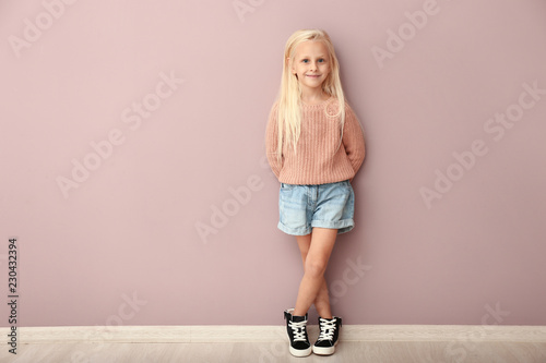 Cute girl in fashionable cl...