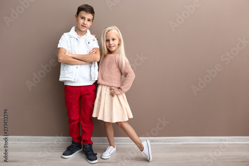 Cute boy and girl in fashio...