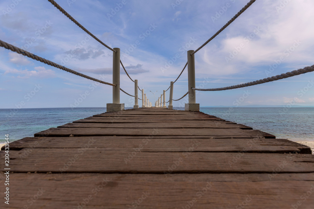 Pier to Sumilon Island Cebu Philippines, in a tranquil scene on a nice sunny day on a artistic perspective photo Pier to Sumilon Island Cebu Philippines, in a tranquil scene on a nice sunny day on a artistic perspective photo