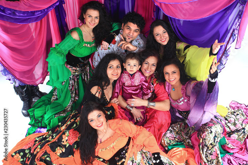 portrait of a Gypsy dance group on the background of the tent