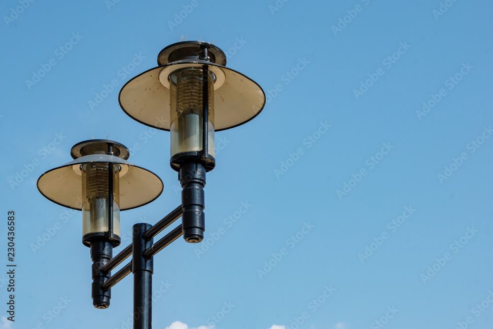 double street lamp on blue sky background double street lamp on blue sky background