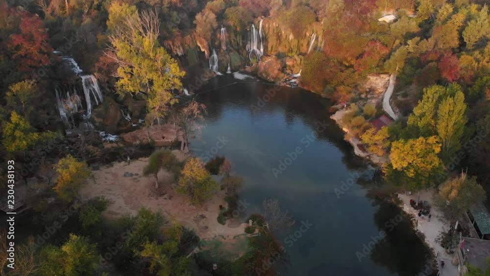 Aerial drone fly over Kravica waterfall in Bosnia at autumn season. Aerial drone fly over Kravica waterfall in Bosnia at autumn season.